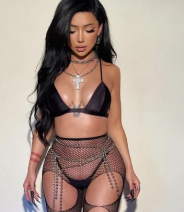 Nikita Nguyen onlyfans model picture standing wearing sexy black lingerie