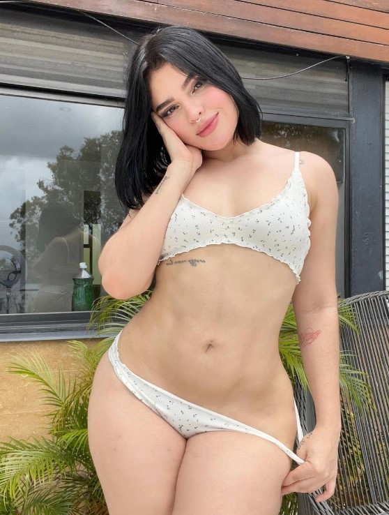 @saabsilvi onlyfans model picture standing wearing a white bikini