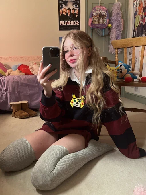 Belle Delphine onlyfans model taking mirror selfie wearing long socks