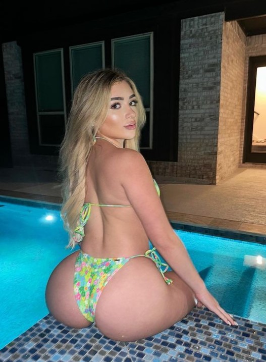 Faith Lianne onlyfans model sitting beside the pool