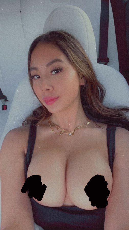 @asian.candy Onlyfans model picture wearing black top and showing her boobs