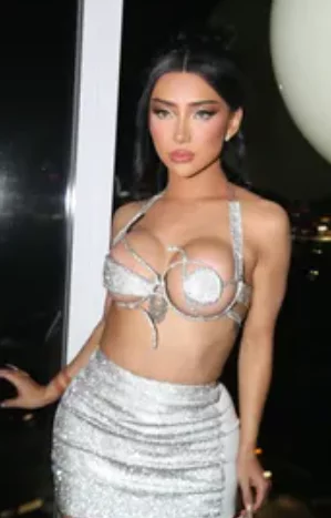 Nikita Nguyen onlyfans model picture standing wearing sexy clothes