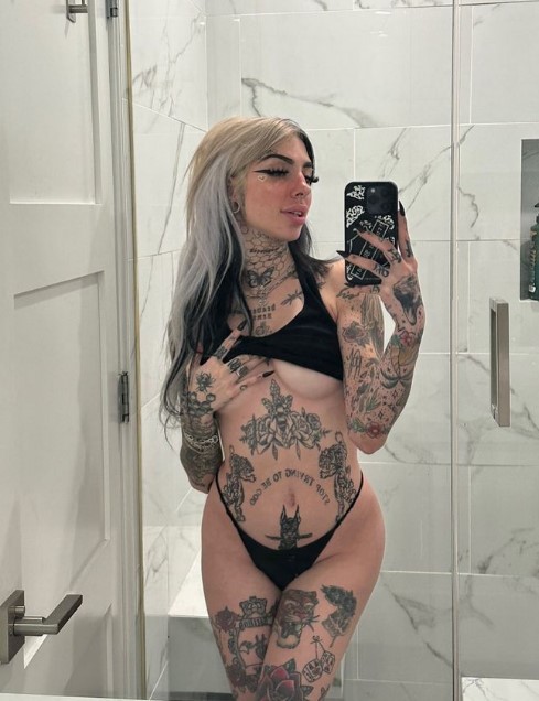 Cruella Morgan onlyfans model ig leaks picture standing wearing a black bikini