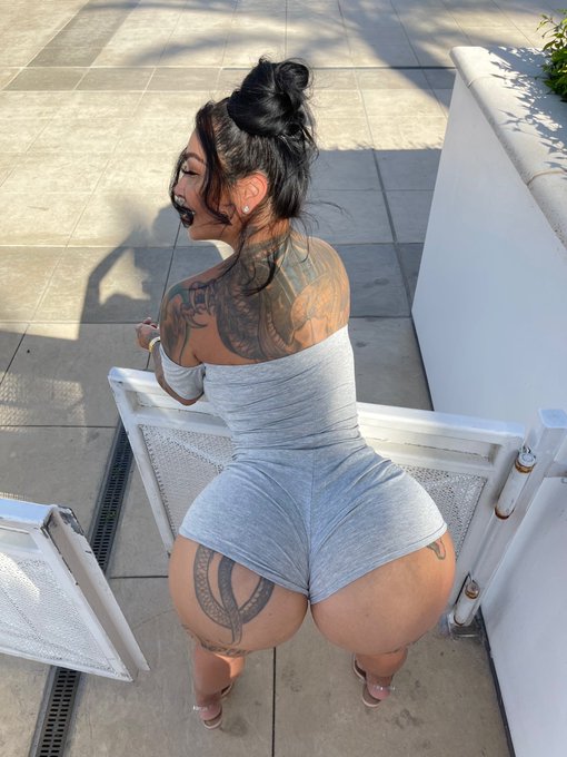 Brittanya Razavi onlyfans model picture wearing sexy gray one piece