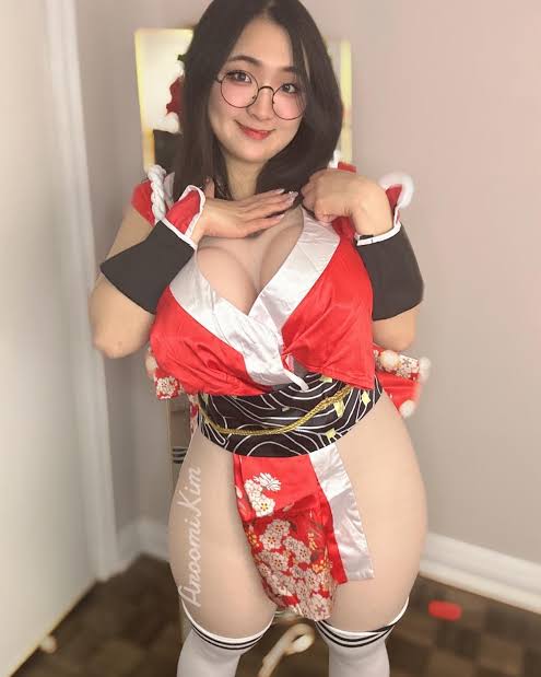 @aroomikim onlyfans model picture standing wearing a sexy costume