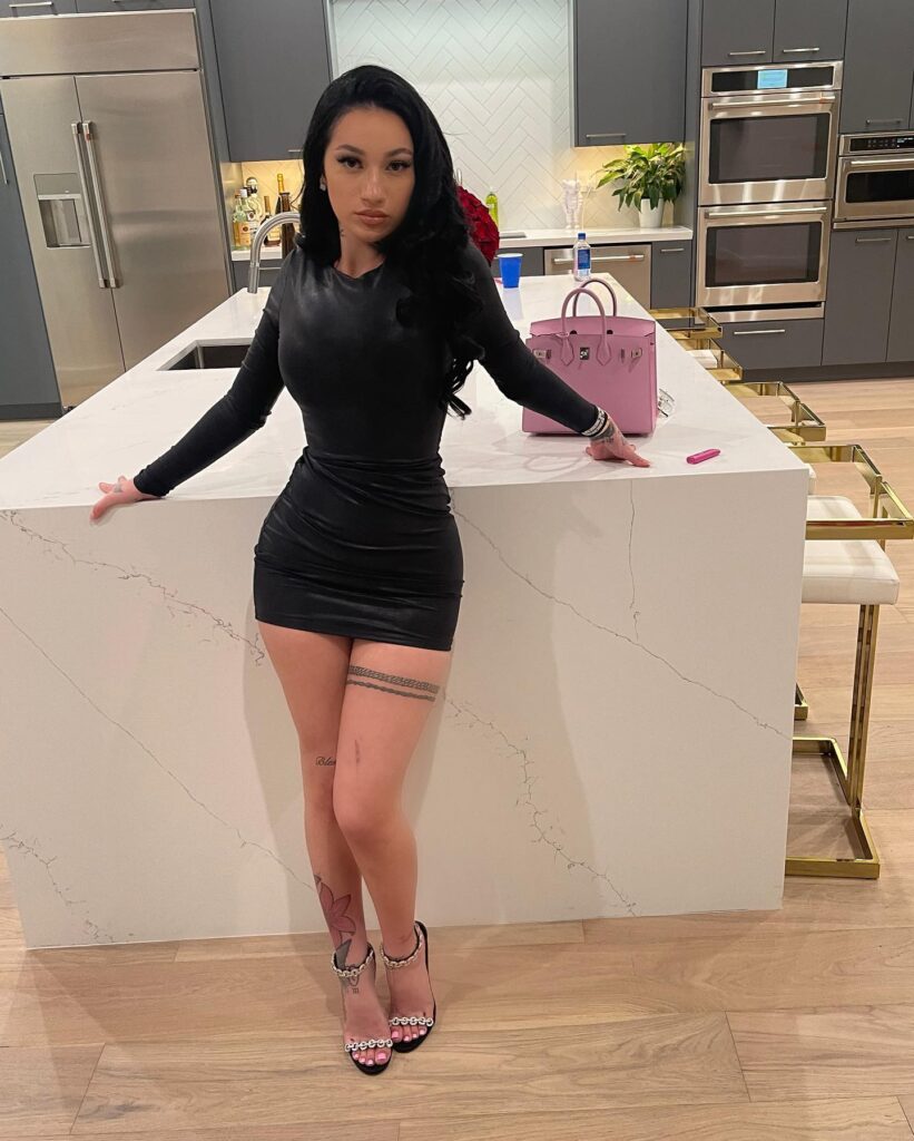 @bhadbhabie onlyfans model standing wearing black dress