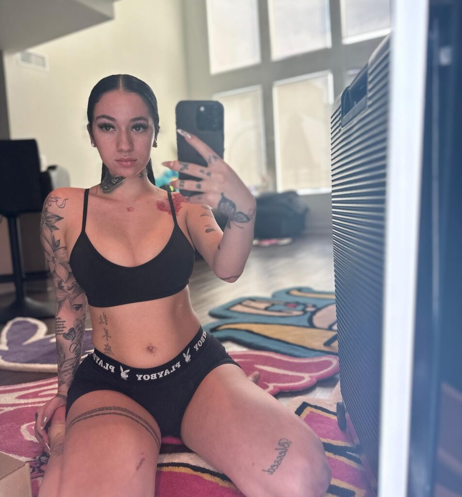 @bhadbhabie onlyfans model sitting on the floor wearing black