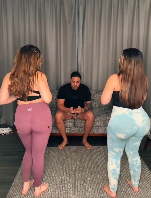 @katandromeo onlyfans model one man sitting and two girls standing