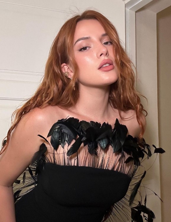 bella thorne OnlyFans model wearing a black dress