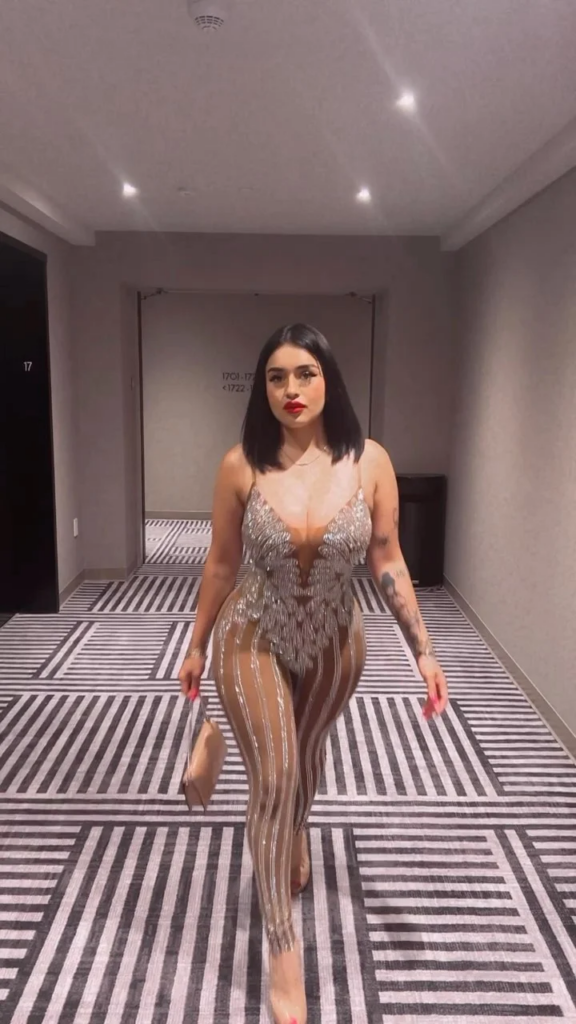 Marlene Santana OnlyFans @marlene2995  walking wearing a dress holding a purse