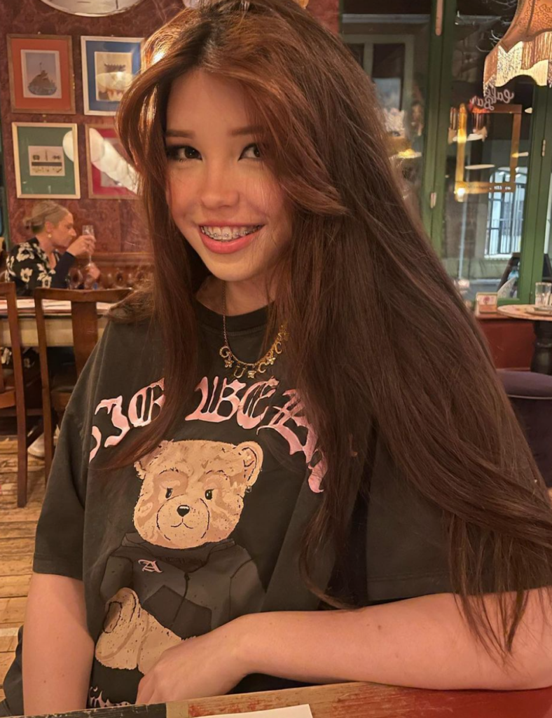 Mary-Belle Kirschner @belledelphine sexy photo in a bar wearing a shirt