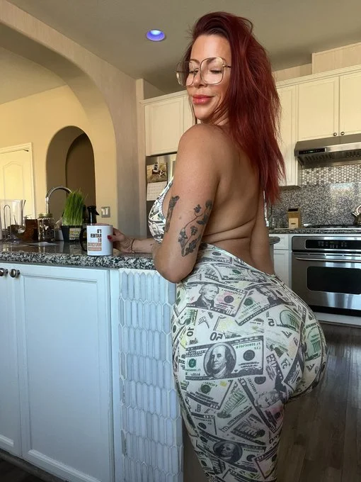 Alexis Fawx onlyfans model picture standing wearing dollar bill designed leggings