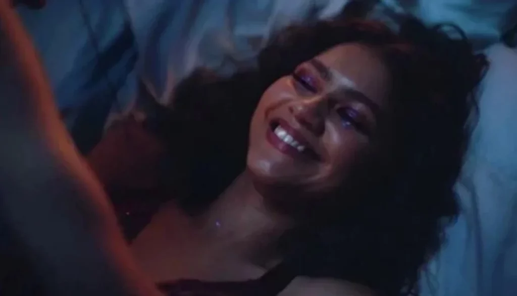 Zendaya Coleman laying down to bed smiling