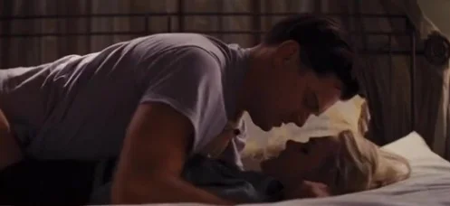 Margot Robbie sex scene in the movie the wolf of wall street. She is laying down to bed with a man 