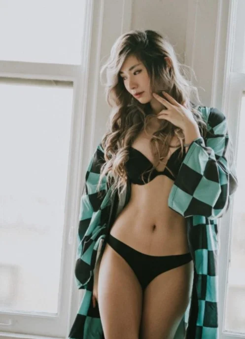 Leena Xu (@leena) Fansly model picture standing wearing checkered coat and black underwear