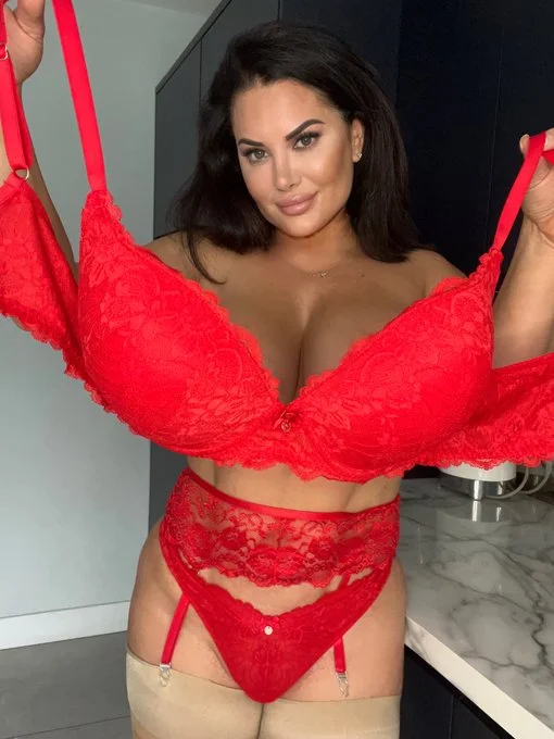 Sophie Lawson onlyfans model picture standing holding a red bra