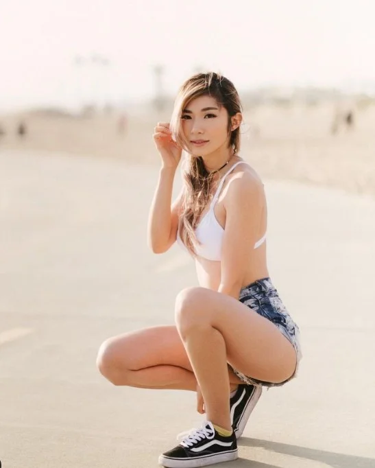 Leena Xu (@leena) Fansly model picture outside wearing white top and denim short
