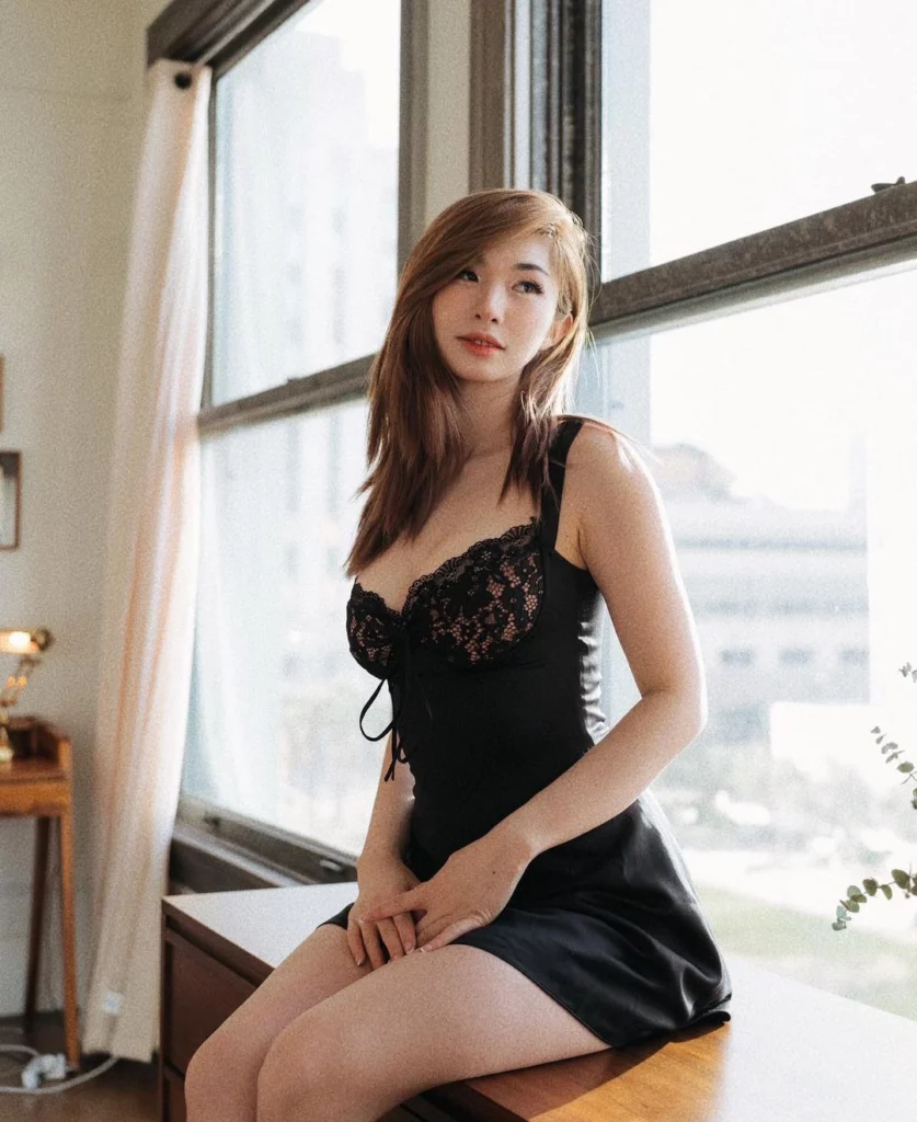 Leena Xu (@leena) Onlyfans model picture sitting wearing black lingerie