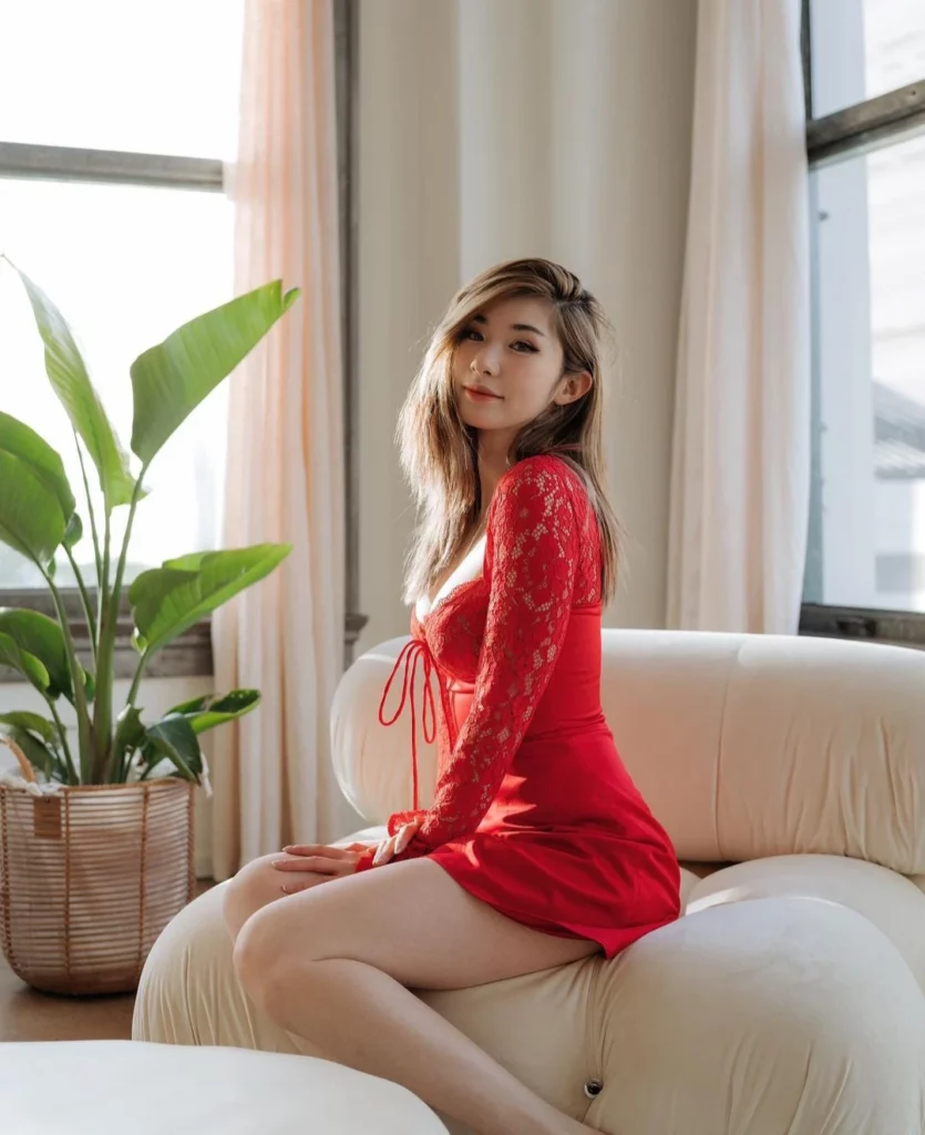 Leena Xu (@leena) Fansly model picture sitting wearing sexy red dress
