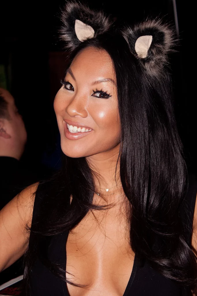 Asa Akira OnlyFans model and a lookalike of Lucy Liu picture wearing headband and a black top