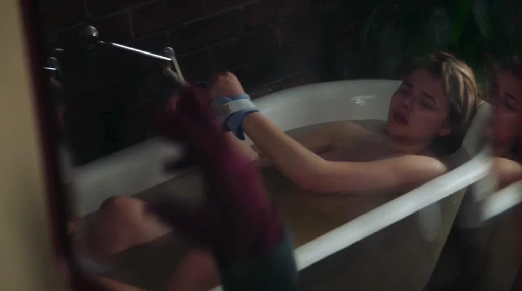 Chloe Grace Moretz leaks in the movie Greta. She is in bathtub tied up naked