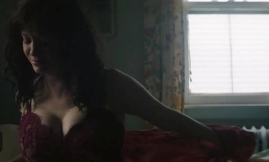 Christina Hendricks leaks in the movie God's Pocket. She is wearing red bra and she is putting her clothes