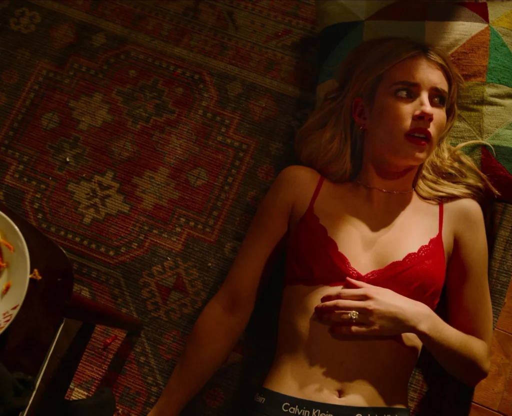 Emma Roberts leaks in the movie Hotdate. She is lying down to floor wearing red bra