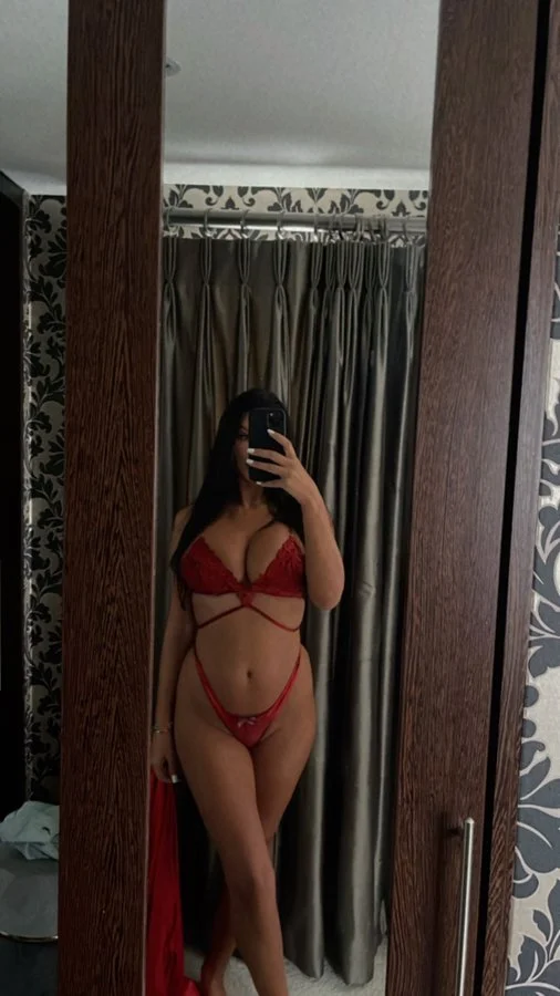 Alice Goodwin onlyfans model picture standing wearing red bikini