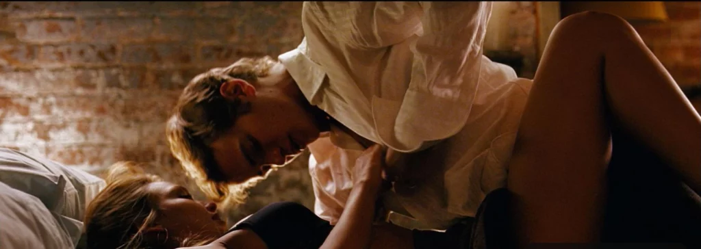 Jessica Alba leaks in the movie Awake. She is lying down with a man removing his white polo