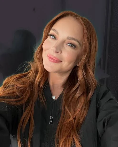 Lindsay Lohan selfie wearing black jacket