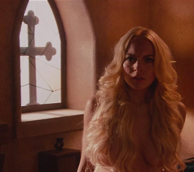 Lindsay Lohan movie leaks in the movie Machete. She is standing naked and her hair covering her boobs