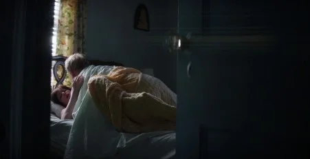 Christina Hendricks leaks in the movie God's Pocket. She is in bed doing sex with a man