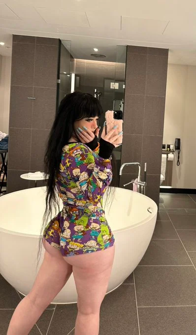 Lara Rose onlyfans model picture standing on the bathroom