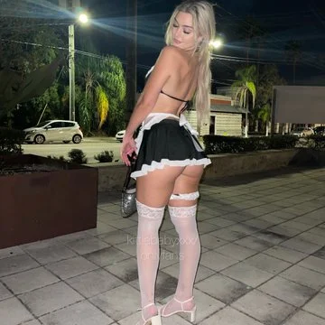@kittiebabyxxx onlyfans model picture standing wearing sexy black skirt