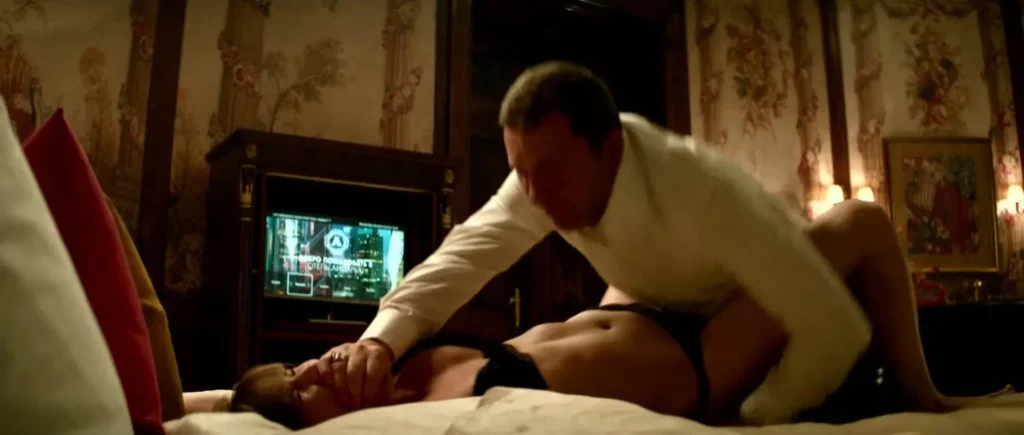 Jennifer Lawrence leaks in the movie Red Sparrow. She is lying down to bed with a man above her covering her mouth