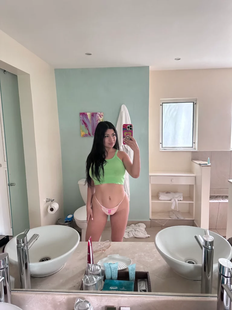 Cami Strella (@camistrella) OnlyFans model picture in bathroom wearing green top