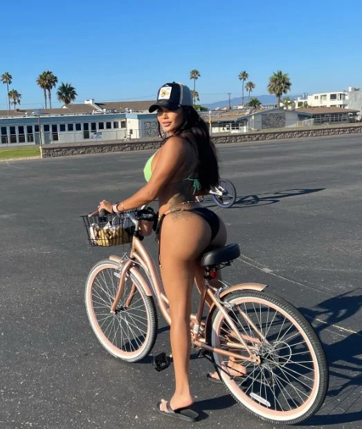 Daisy Marie (@daisymarie) OnlyFans model picture riding a bicycle wearing black panty