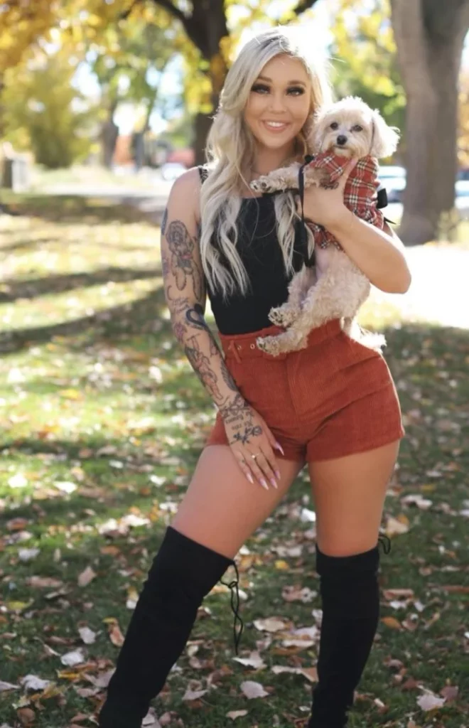 Kali Roses, aka @kaliroses Onlyfans model sexy photo holding pet dog