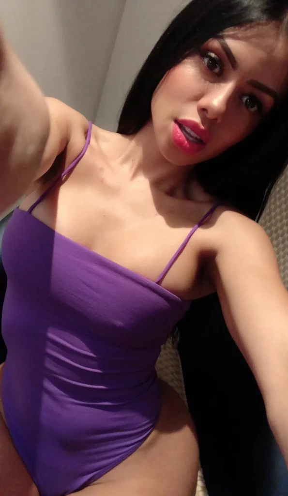 Canela Skin (@canelaskinx) OnlyFans model selfie wearing purple one piece