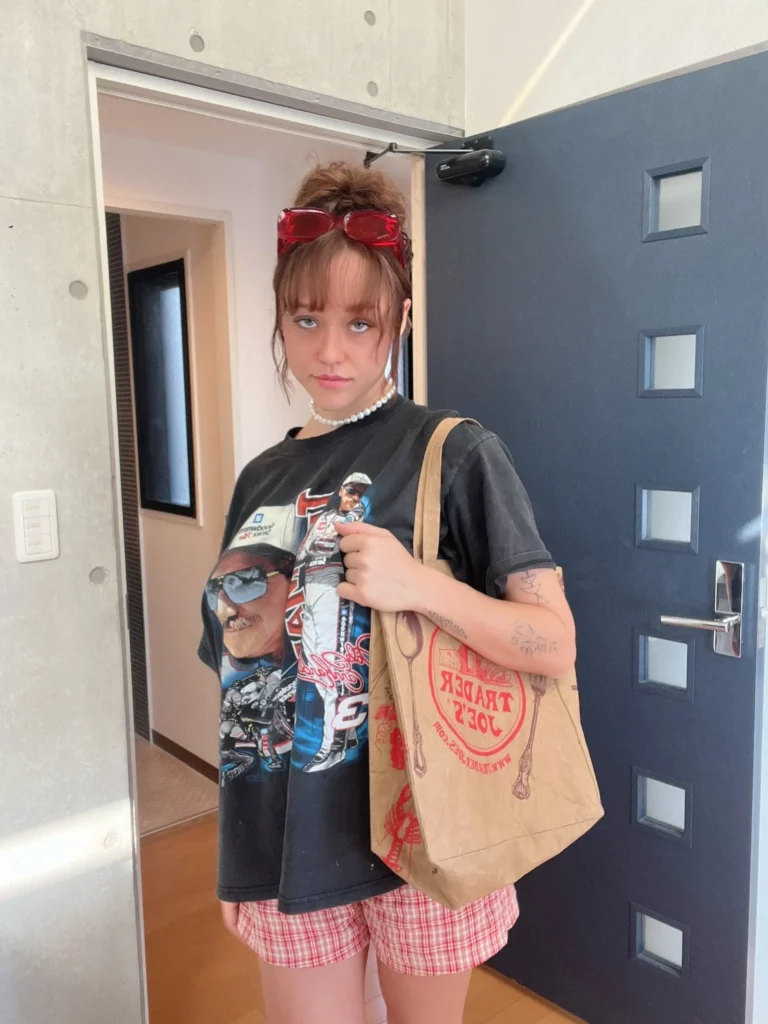 Sabrina Nichole (@sabrinanichole) OnlyFans model sexy picture standing wearing brown bag