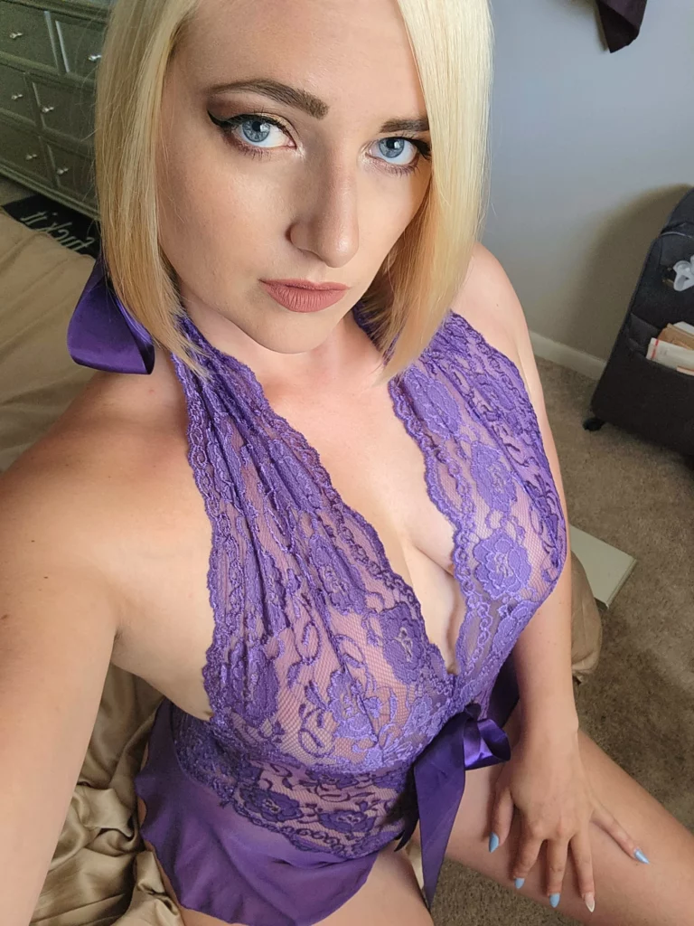 Kate England (@kateengland21) OnlyFans model sexy selfie wearing purple top