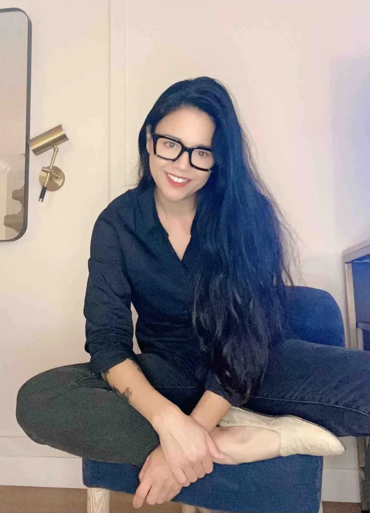 Dana Vespoli (@thedanavespoli) OnlyFans model sexy picture sitting wearing glasses and black polo top