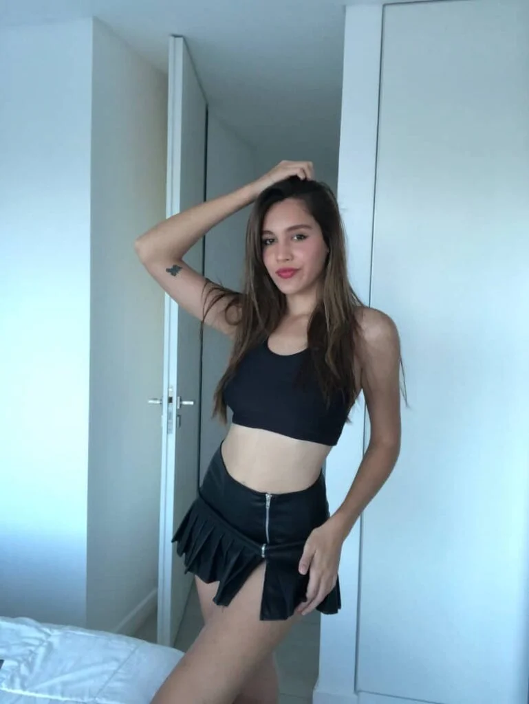 Clara Blanc (@clarablanc) OnlyFans model picture wearing black top and skirt