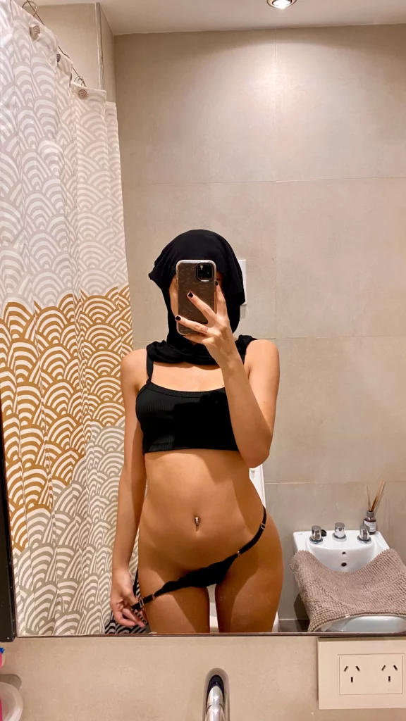 Melina Lox (@melinalox) OnlyFans Model picture in bathroom wearing black top and panty