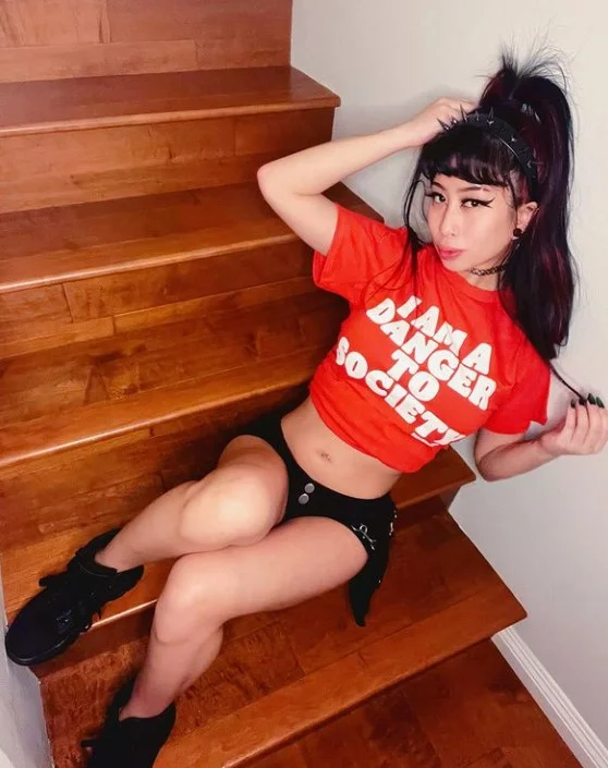 Jade Kush (@kushqueenj) OnlyFans model picture in stair wearing red top